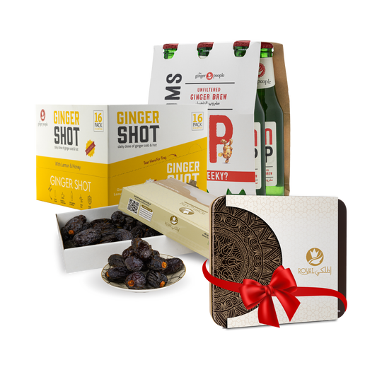 عرض تمر المجدول مع مشاريب الزنجبيل وعلبة معدن